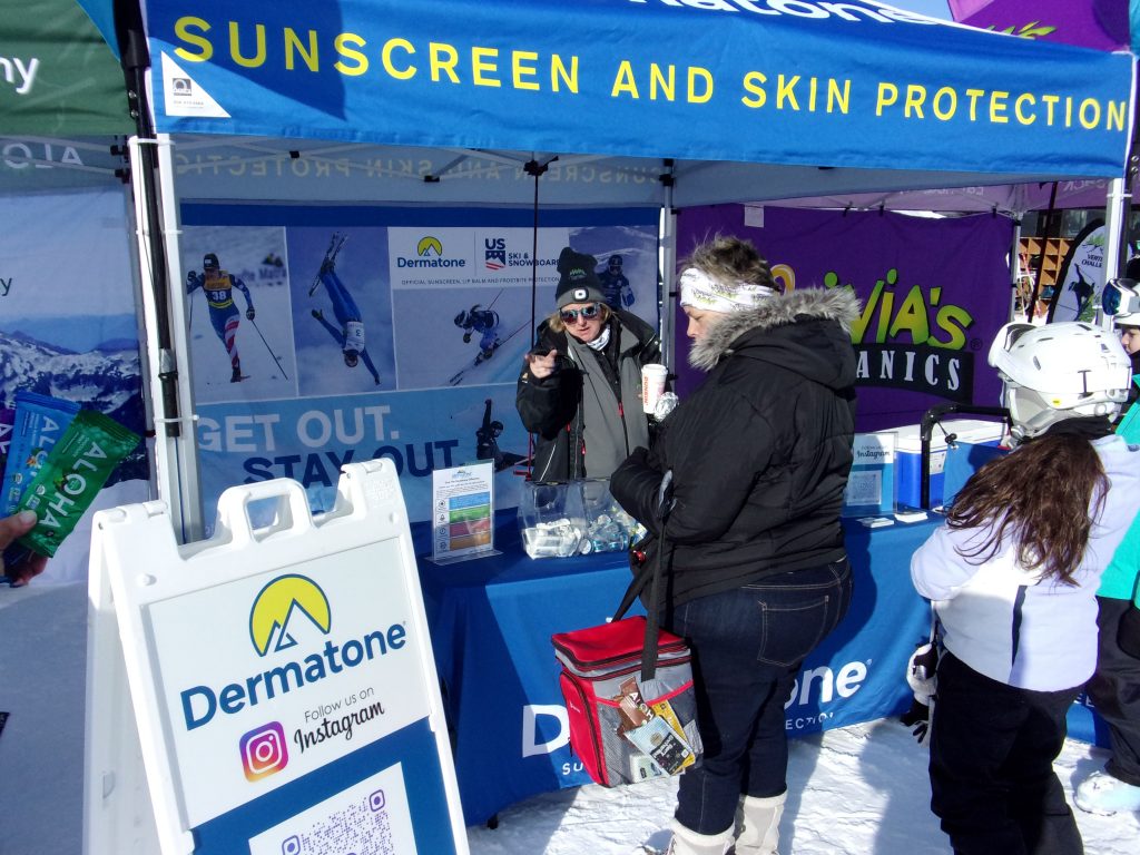 A woman samples suncreen, a key ski element